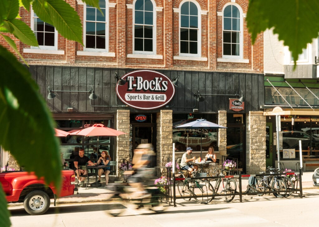 A couple enjoys a meal outside of T-Bock's Sports Bar and Grill in Downtown Decorah